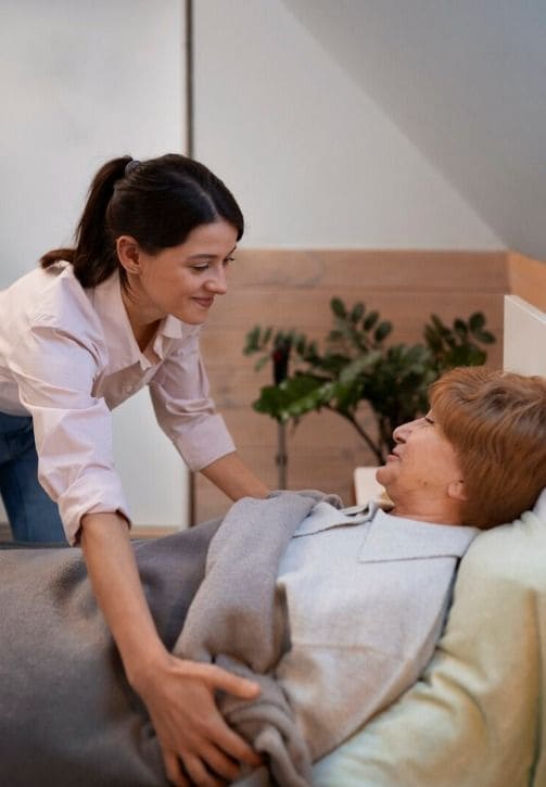 Red Rose Care caregiver supporting a resident